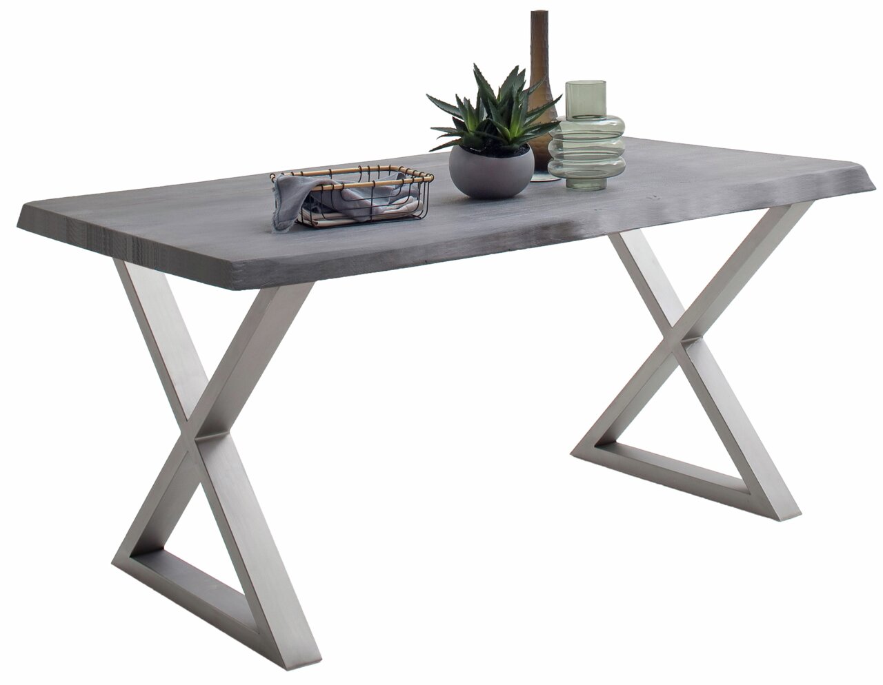 Moderne eettafel met X-vormige metalen poten en een grijs tafelblad, gezien vanaf de zijkant