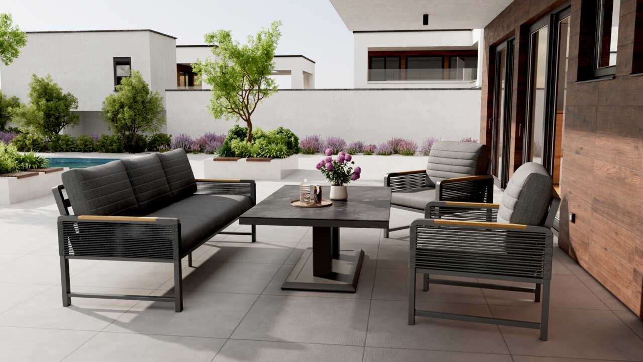 Ambia Garden Sitzbank 2-sitzig CALIDA Moderne Loungegarnitur auf einer Terrasse mit Blick auf einen Garten, bestehend aus einem Tisch, einem Sofa und Sesseln in stilvollem Design.