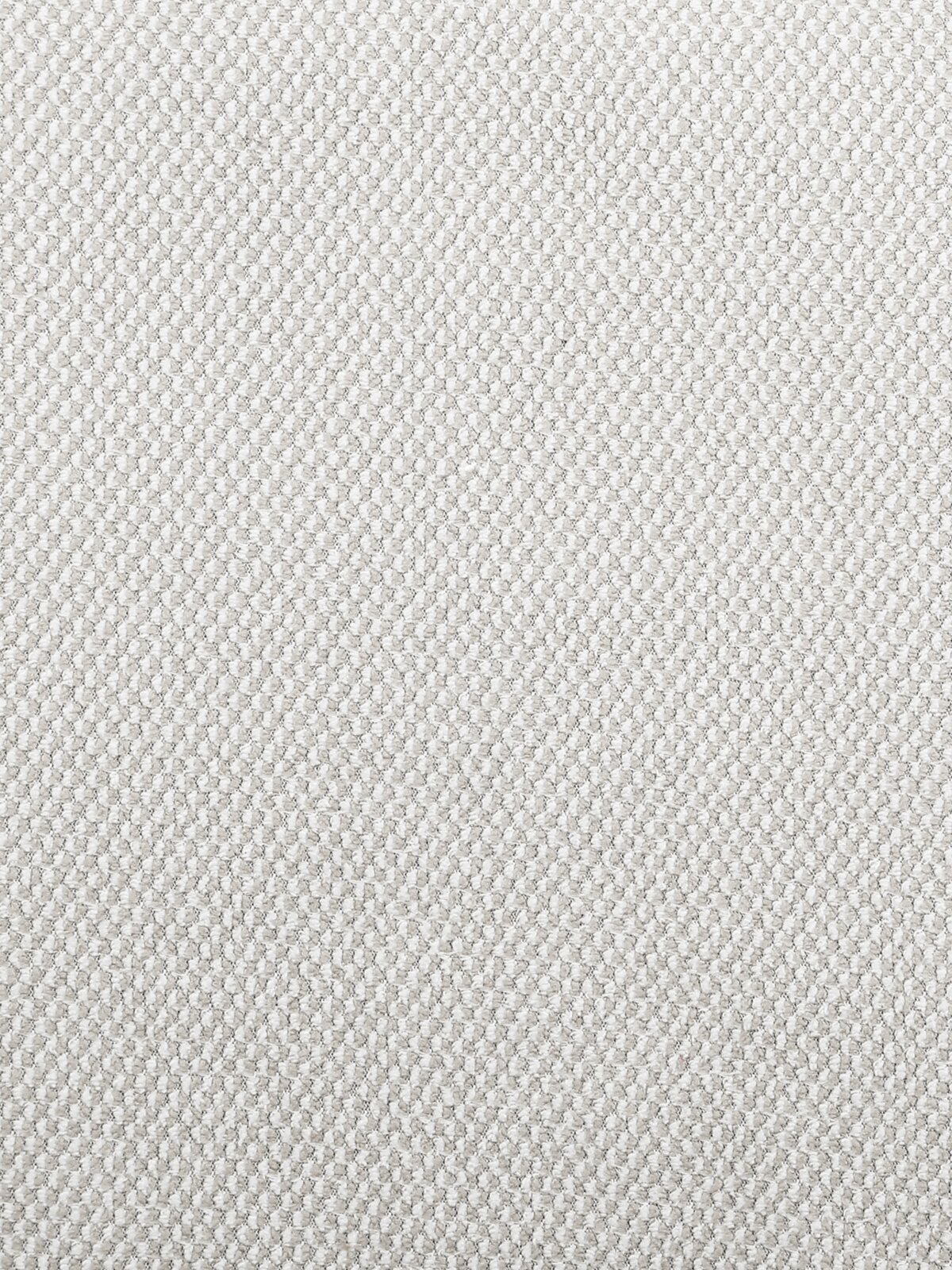 Nahaufnahme eines hellen, strukturierten Stoffes in beige Farbe, verwendet für einen Armlehnstuhl.