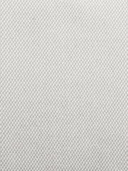 Nahaufnahme eines hellen, strukturierten Stoffes in beige Farbe, verwendet für einen Armlehnstuhl.