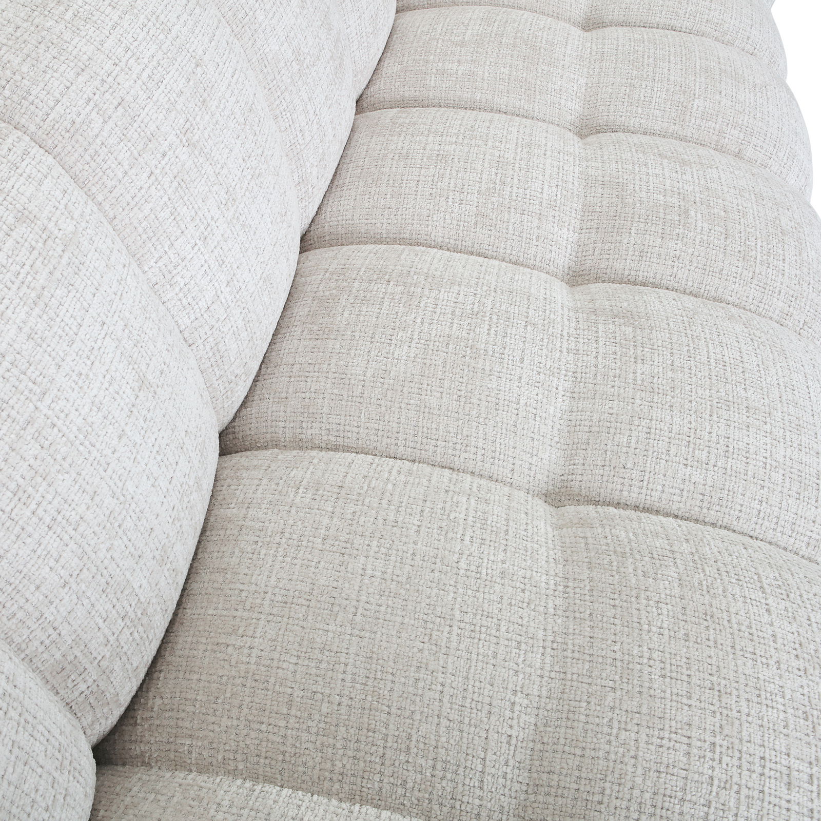Nahaufnahme eines hellgrauen, strukturierten Big-Sofas aus der Vogelperspektive.