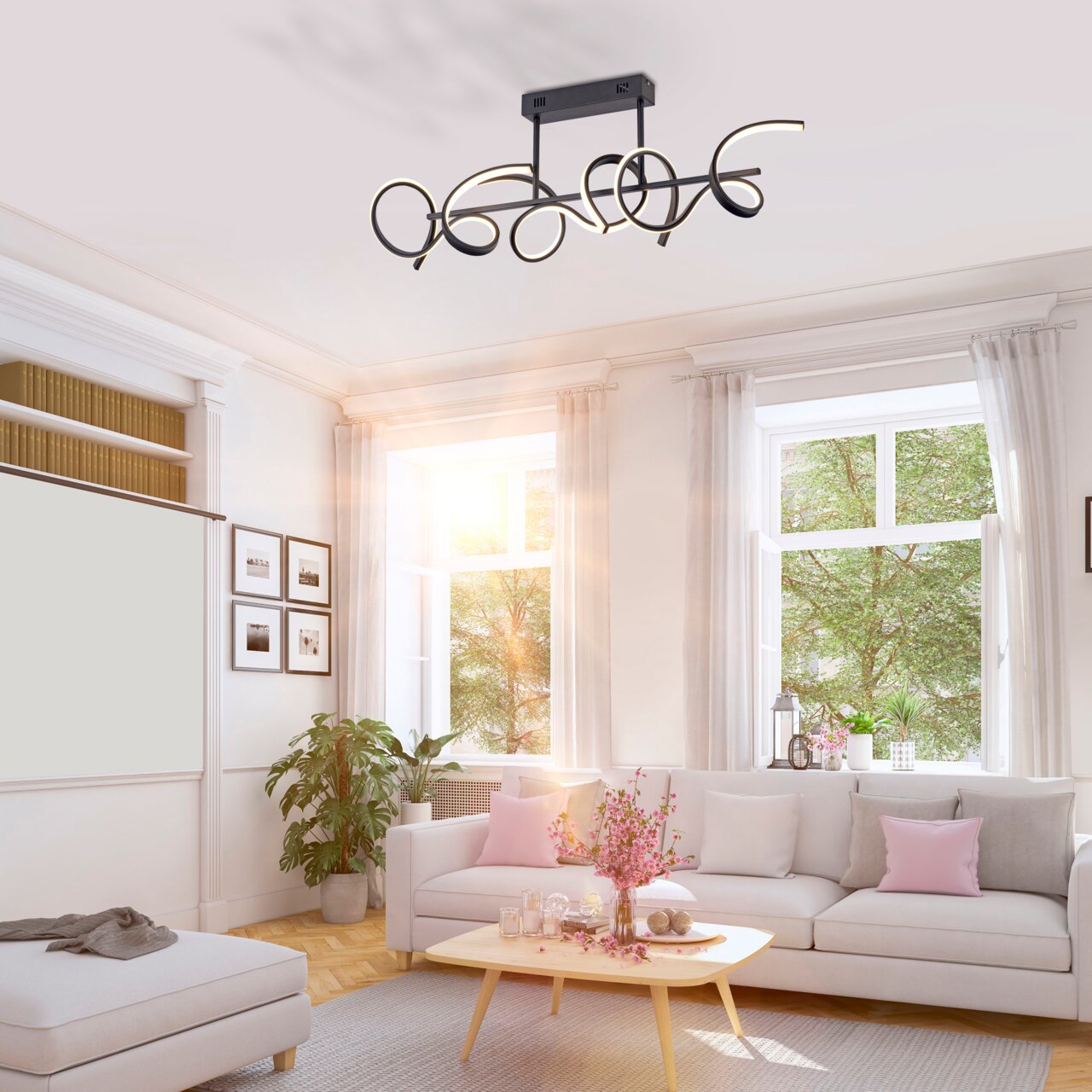 Moderne Deckenleuchte CURLS in einem hellen Wohnzimmer, von unten betrachtet, mit geschwungenem Design und schwarzem Finish.