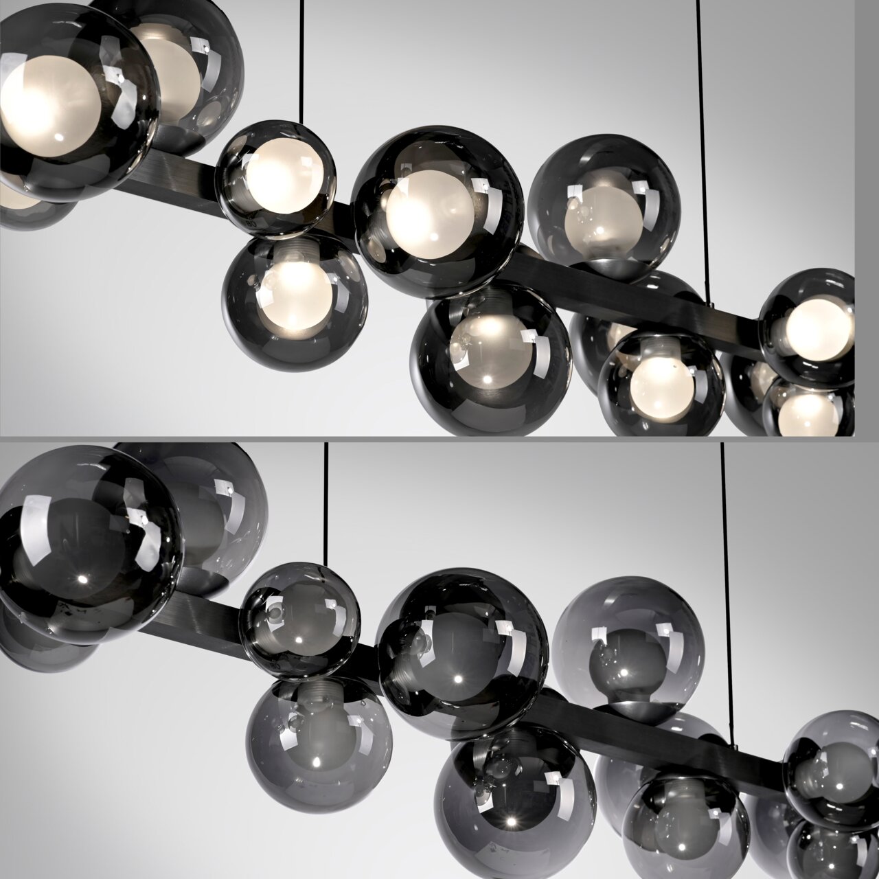 Moderne LED-Pendelleuchte mit mehreren rauchgrauen Glaskugeln, seitliche Perspektive.