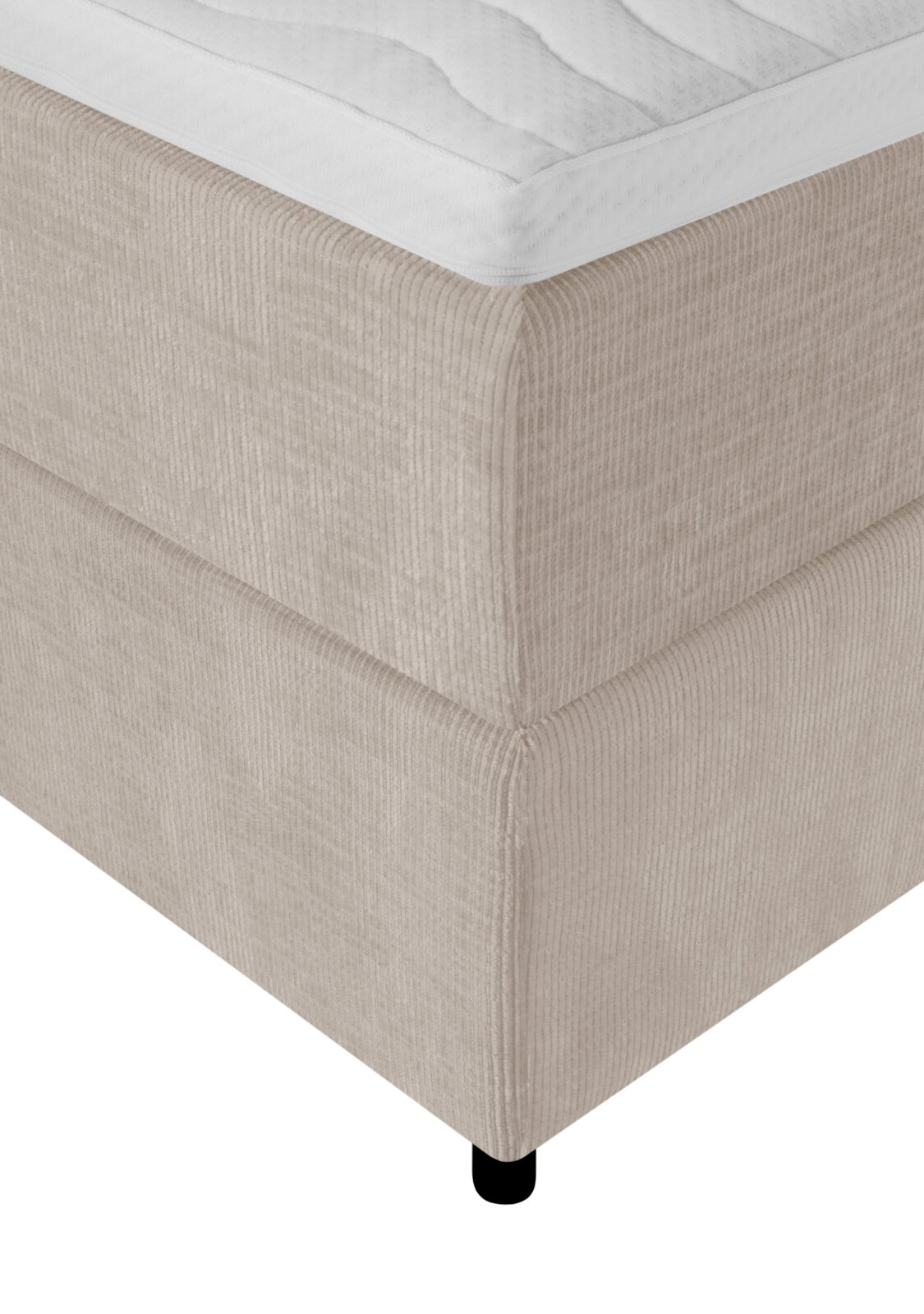 Detailaanzicht van bovenaf op de hoek van een beige boxspring met geribbelde stoffen bekleding, wit matras en zwart pootje