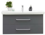 Moderner Waschtisch mit zwei Schubladen in grauer Farbe, darauf eine Pflanze und Seifenspender, Frontalansicht.