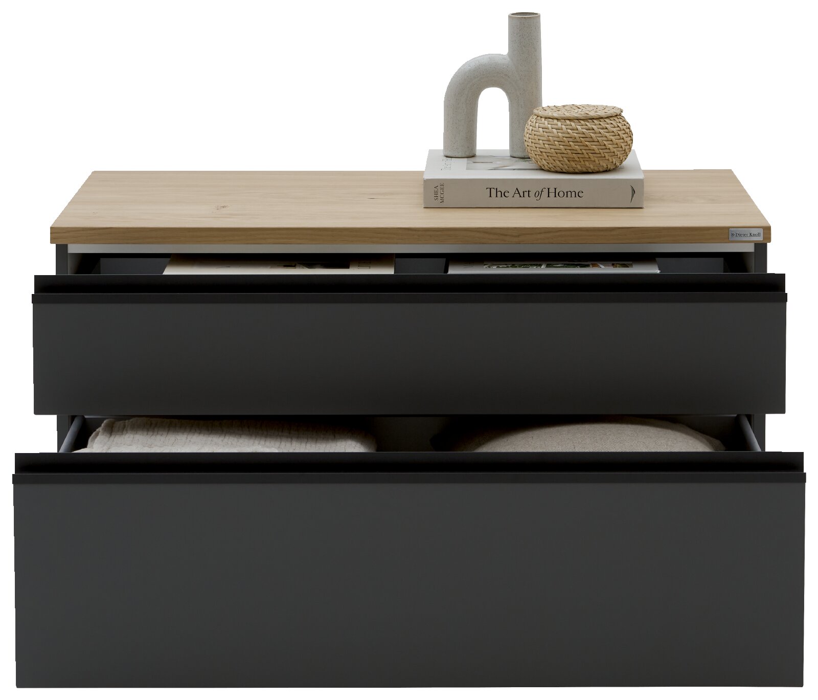 Dieter Knoll Lowboard LENDINA Modernes Sideboard mit zwei schwarzen Schubladen und heller Holzplatte, dekoriert mit Buch, Keramikvase und geflochtenem Korb, frontal in leicht erhöhter Perspektive