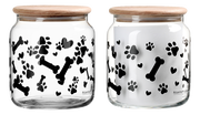 Glasdose mit Holzdeckel, verziert mit schwarzen Pfotenabdrücken, Knochen und Herzen, aus seitlicher Perspektive.