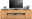 TV-Lowboard aus Holz mit zwei Schubladen und offenen Fächern, darauf ein Fernseher, Pflanzen und ein Bilderrahmen. Frontalansicht.