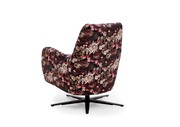 Rückansicht eines Relaxsessels mit floralem Muster und schwarzem Drehfuß.