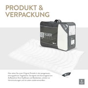 Ganzjahresbettdecke Spessarttraum Faserdecke SILBER in Verpackung, perspektivisch von vorne gezeigt.