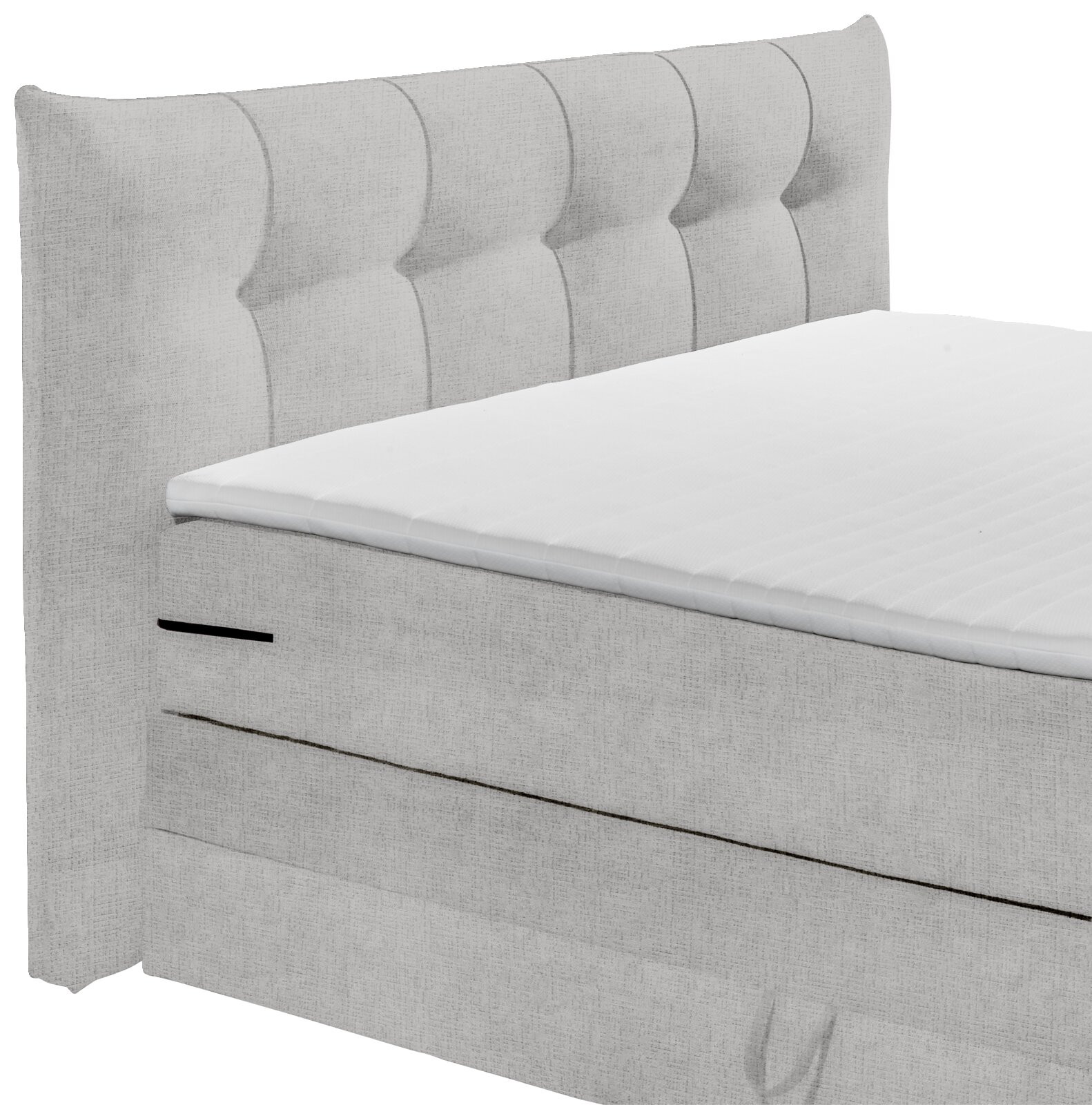Seitliche Ansicht eines grauen Boxspringbetts mit gepolstertem Kopfteil.