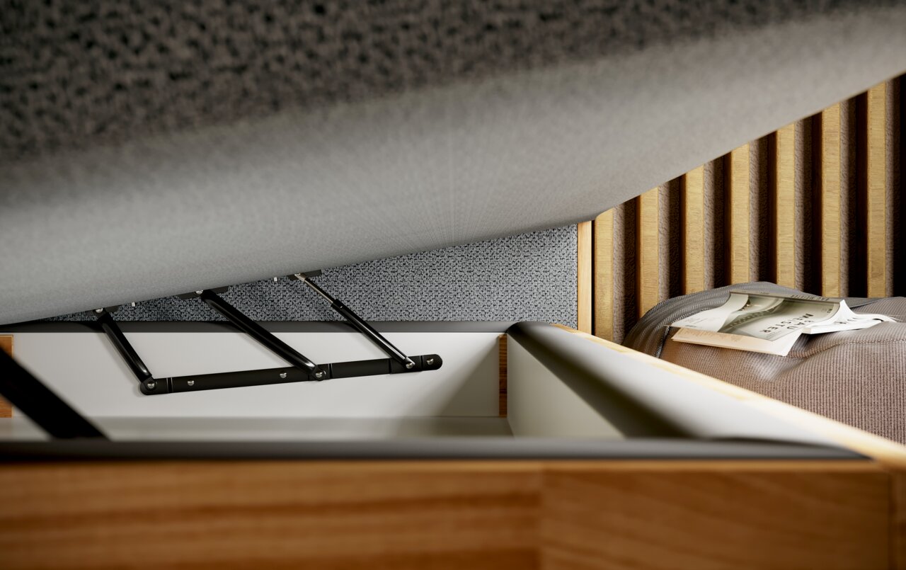 Close-up van een boxspringbed met een opengemaakt matras, waardoor de opbergruimte eronder zichtbaar wordt. Zijaanzicht.