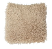 Close-up van bovenaf van een beige, zachte kussen