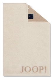 Beiges Gästetuch mit aufgesticktem 'JOOP!' Logo, von oben fotografiert.
