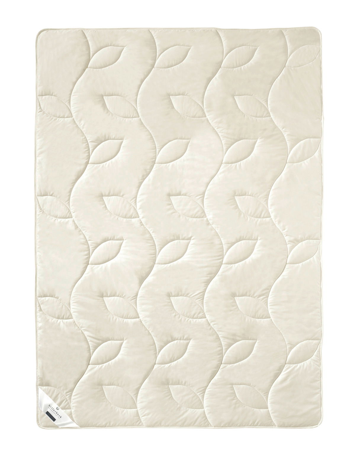 Vogelperspektive auf eine cremefarbene Naturdecke mit Blattmuster-Steppung.