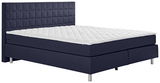 Boxspringbett in dunkelblauem Stoff mit gestepptem Kopfteil, seitliche Perspektive