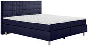 Boxspringbett in dunkelblauem Stoff mit gestepptem Kopfteil, seitliche Perspektive