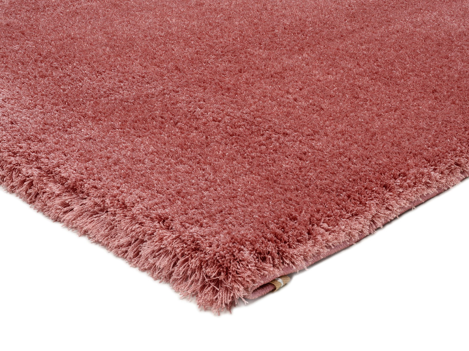 Rosa Teppich Soft Dream, Nahaufnahme der Ecke, zeigt die flauschige Textur und die Fransen.