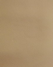 Nahaufnahme einer beige strukturierten Lederoberfläche, verwendet für einen Stuhl.