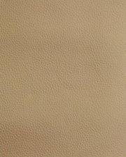 Nahaufnahme einer beige strukturierten Lederoberfläche, verwendet für einen Stuhl.