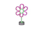 Neon-ledlamp in de vorm van een bloem met roze bloemblaadjes en een groene steel op een grijze voet, vooraanzicht op een witte achtergrond