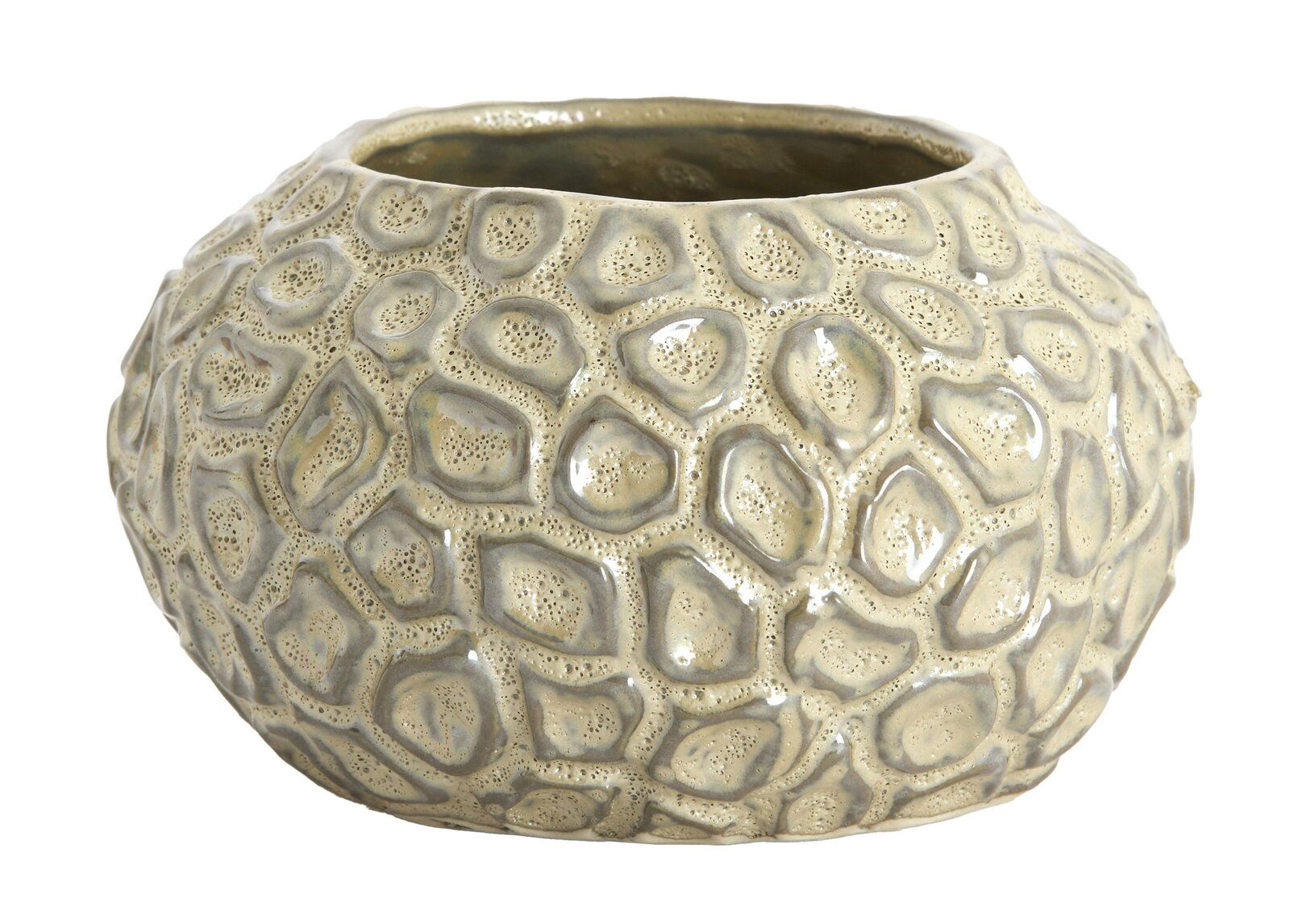 Nahaufnahme eines strukturierten, runden Teelichthalters mit organischem Muster und glänzender Oberfläche.