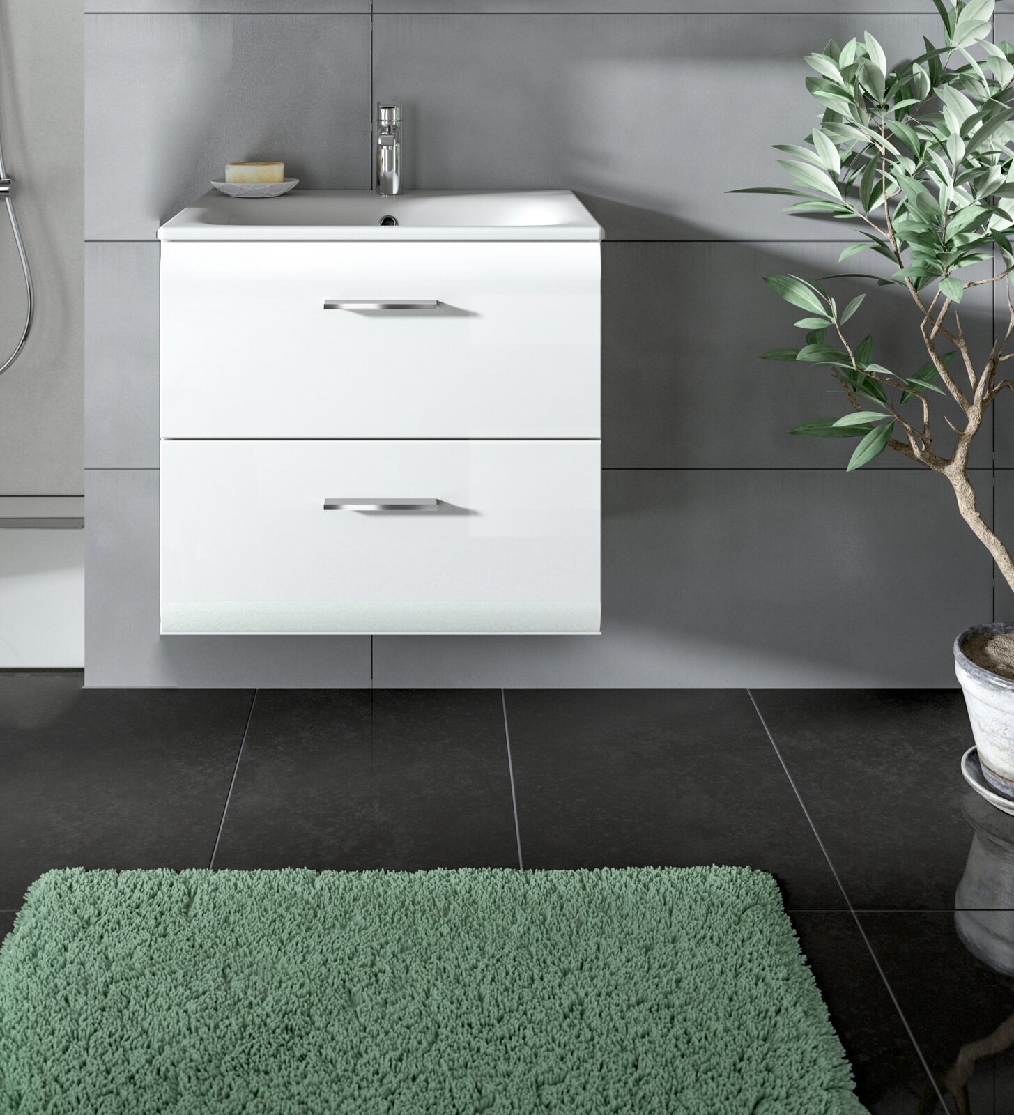 Modernes, weißes, wandhängendes Bad-Waschtischunterschrank-Set mit integriertem Waschbecken, zwei Schubladen und Chromarmatur vor grauer Fliesenwand; Frontalansicht auf Augenhöhe, leicht von links.