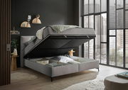 Boxbett mit hochgeklappter Matratze und Stauraum darunter, seitliche Perspektive