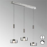 Moderne Pendelleuchte Lavin mit drei höhenverstellbaren, zylindrischen Lampenschirmen aus Glas, seitliche Perspektive