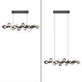 Moderne LED-Pendelleuchte mit mehreren kugelförmigen Leuchtkörpern, seitliche und frontale Ansicht.