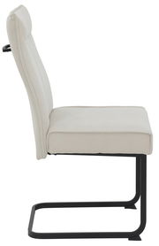 Seitenansicht eines modernen Schwingstuhls mit beigem Polster und schwarzem Metallgestell.