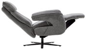 Grijze tv-fauteuil in zijaanzicht, volledig achterovergeleund op een zwart draaivoet.