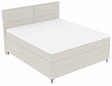 Boxspringbett in seitlicher Perspektive mit hellem Stoffbezug und schlichtem Design