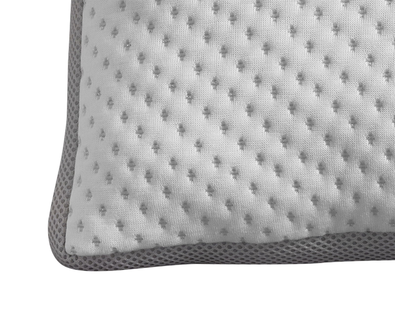 Nahaufnahme eines Komfortschlafkissens mit strukturierter Oberfläche und grauem Rand.