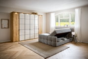 Boxbett mit Stauraum in einem modernen Schlafzimmer, seitliche Perspektive