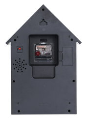 Rückansicht einer Wanduhr in Form eines Hauses mit sichtbarem Uhrwerk und Lautsprecher.