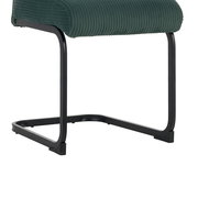 Seitenansicht eines XORA Schwingstuhls GONZO mit grünem Stoffbezug und schwarzem Metallgestell.