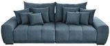 Großes, modernes Big-Sofa in blauer Stoffoptik mit mehreren Kissen, Frontalansicht.