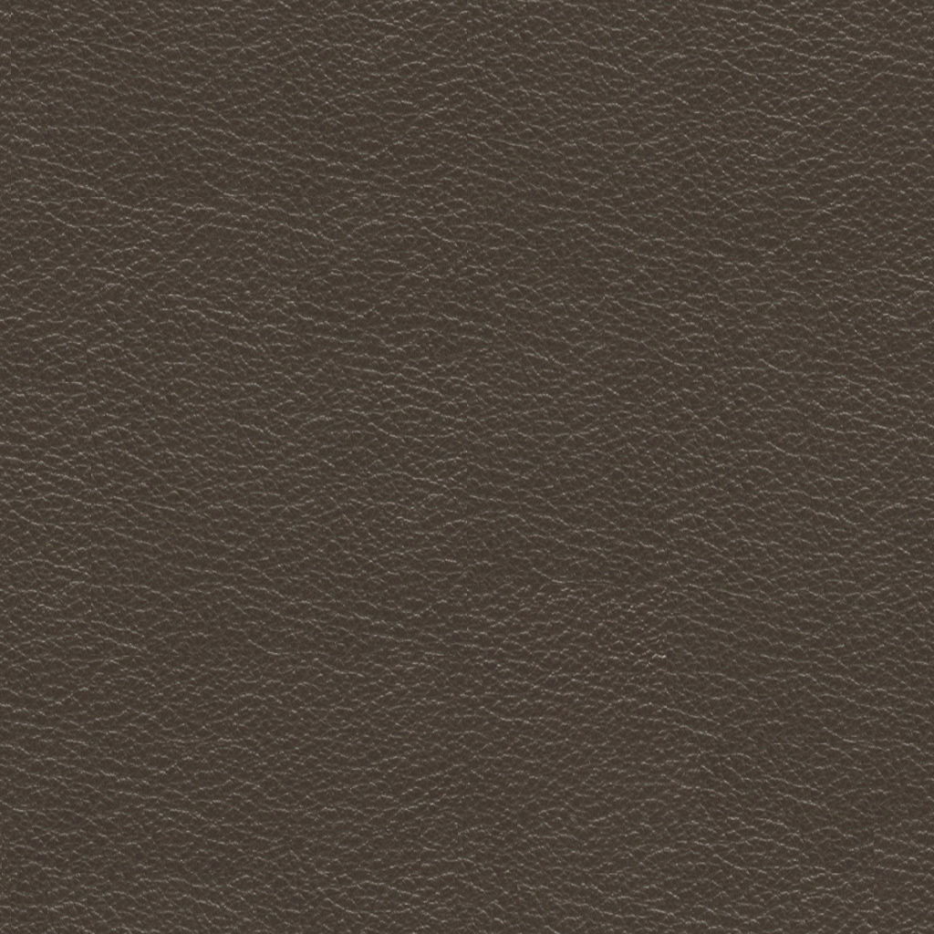 Nahaufnahme von dunkelbraunem Leder mit feiner Narbung, verwendet für einen Chefsessel.