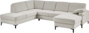 Hellbeiges U-förmiges Ecksofa mit zwei Ottomane/Chaiselongue-Elementen, Stoffbezug und schwarzen Metallfüßen, Ansicht schräg von vorne.