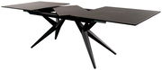 Moderner ausziehbarer Esstisch mit schwarzer Tischplatte und schrägen Beinen, seitliche Perspektive