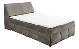 Boxspringbett in seitlicher Perspektive mit grauem Stoffbezug und weißer Matratze