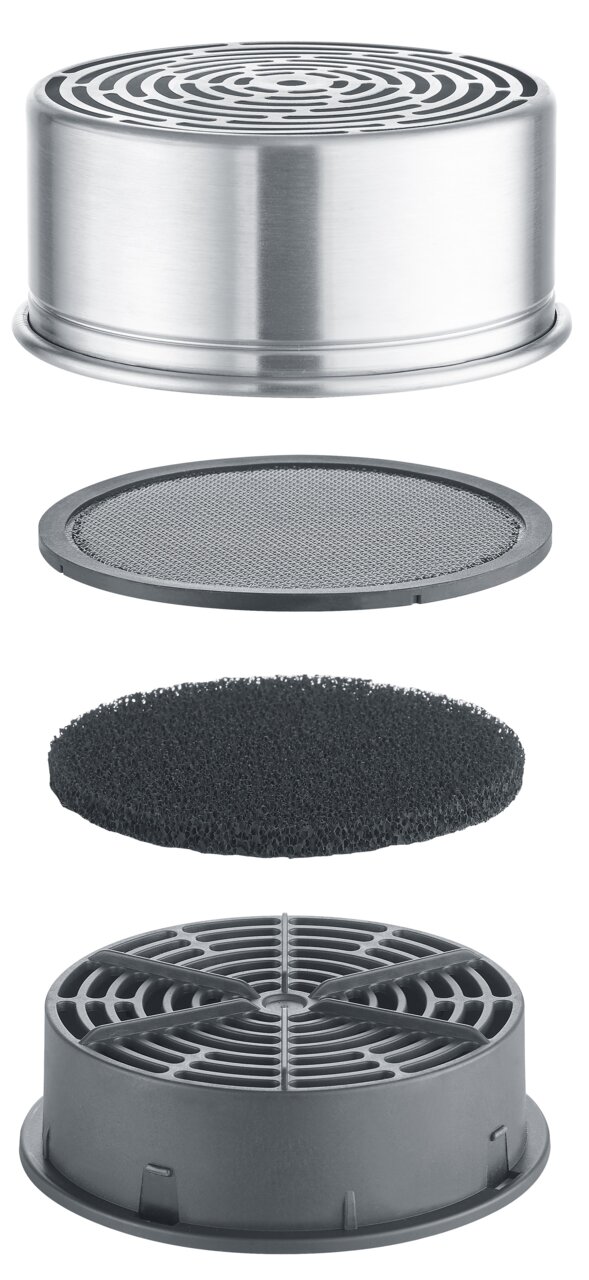 Explosionsansicht eines rauchfreien Raclette-Filters mit mehreren Schichten aus Metall und Kunststoff, seitliche Perspektive.