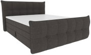 Dunkelgraues, gepolstertes Boxspringbett mit stoffbezogenem, geknöpftem Kopf- und Fußteil, schräg von vorn links in 3/4-Perspektive auf weißem Hintergrund
