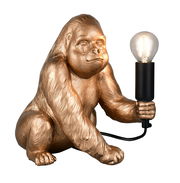 Goldene Tischleuchte in Form eines Gorillas, der eine Glühbirne in der Hand hält, seitliche Perspektive
