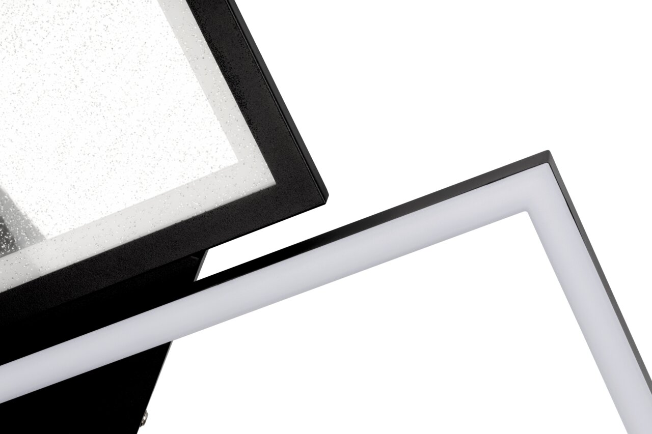Nahaufnahme einer modernen LED-Deckenleuchte mit geometrischem Design und schwarzem Rahmen, seitliche Perspektive.