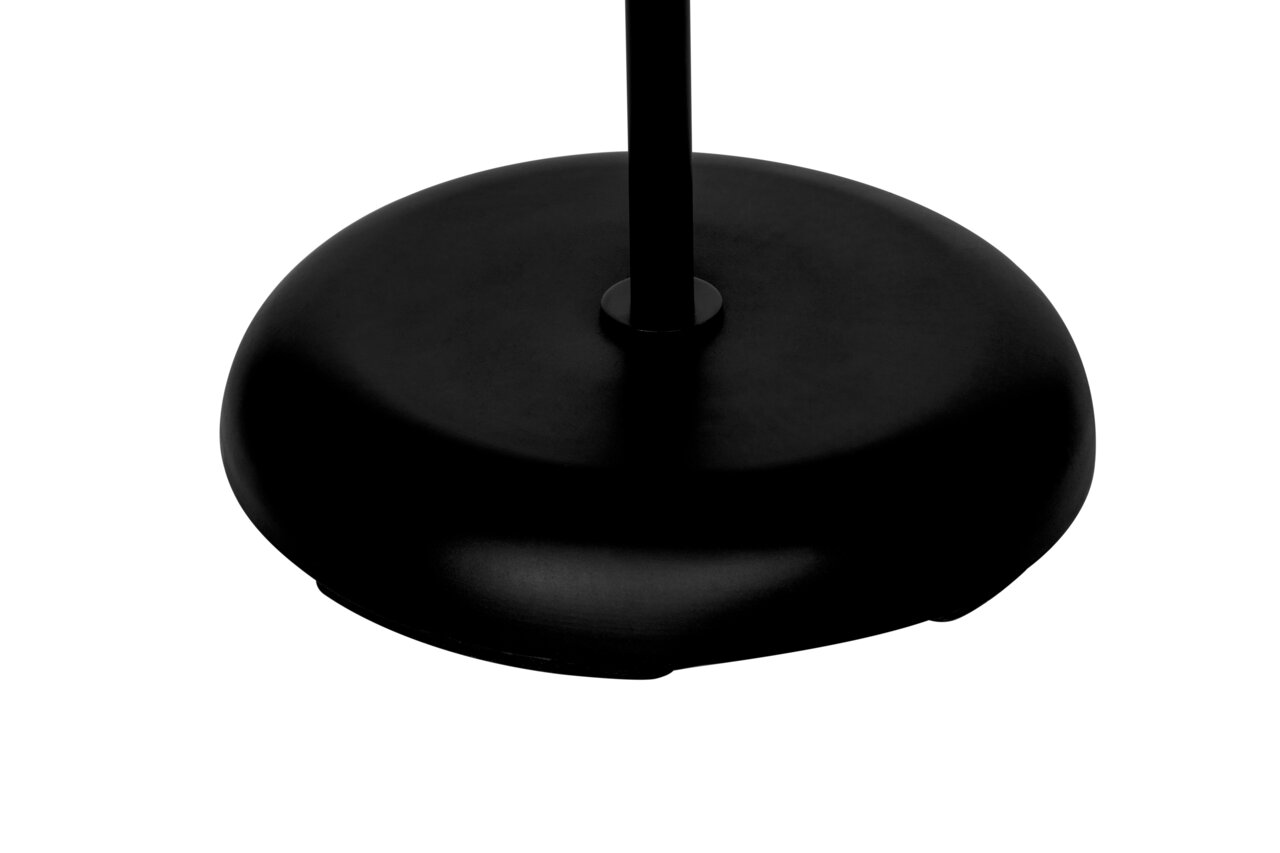 Zwarte voet van een staande lamp, gezien van bovenaf