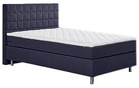 Boxspringbett in seitlicher Perspektive mit gepolstertem Kopfteil und eleganten Metallfüßen