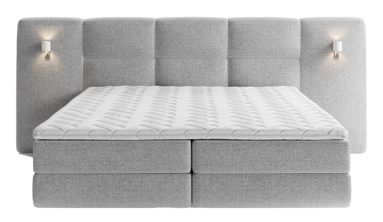 Frontale Ansicht eines grauen Boxspringbetts mit gepolstertem Kopfteil und integrierten Wandlampen.