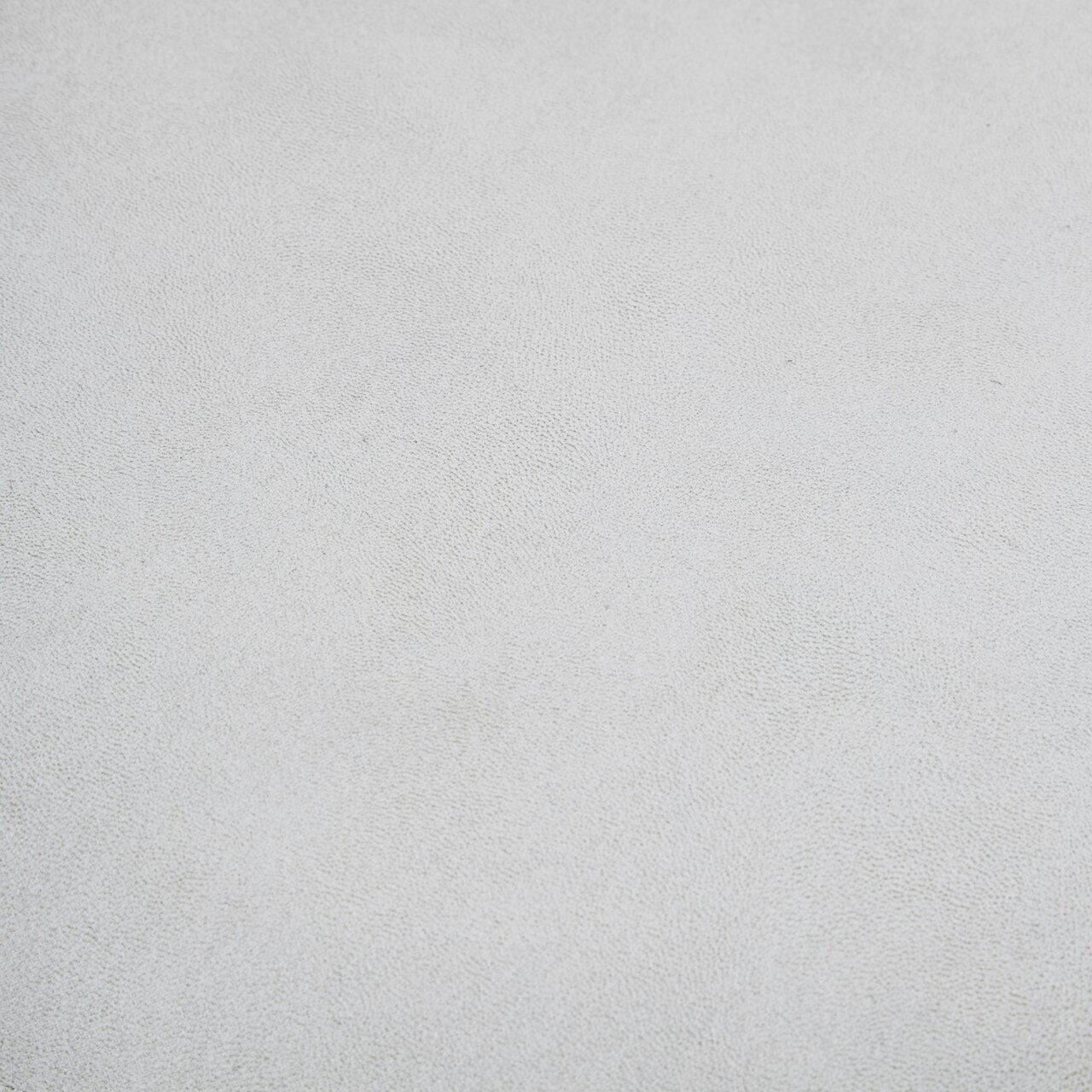 Ti´me Stuhl CLEMENS Nahaufnahme der Textur eines hellgrauen Stoffes, möglicherweise Sitzfläche des Stuhls CLEMENS.